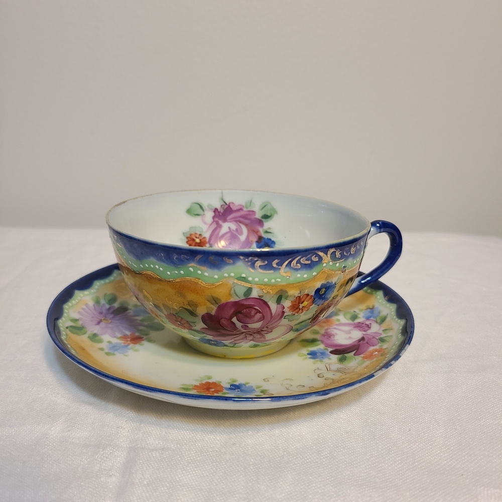 Floral Teacup and Saucer Set with Blue Accents